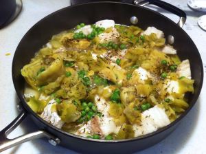 Arrange the fish and scatter the peas and artichoke bits